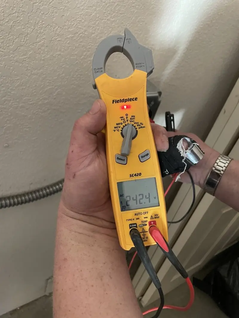 Voltage testing with clamp meter during Generator Installation in Oconomowoc